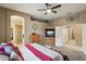 Bright bedroom with a king-size bed and access to a bathroom at 26616 N 42Nd Way, Cave Creek, AZ 85331