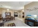 Dining area with a large TV and view into living room at 26616 N 42Nd Way, Cave Creek, AZ 85331