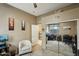 Bright home office featuring built-in desk and mirrored closet at 26616 N 42Nd Way, Cave Creek, AZ 85331