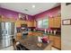 Island kitchen with granite countertops and wood cabinetry at 26616 N 42Nd Way, Cave Creek, AZ 85331