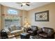 Living room with leather seating and a large window at 26616 N 42Nd Way, Cave Creek, AZ 85331