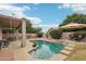 Stunning pool area with patio furniture and lush landscaping at 26616 N 42Nd Way, Cave Creek, AZ 85331