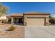 Single-story home with a two-car garage and desert landscaping at 2878 N Paisley Ave, Casa Grande, AZ 85122