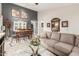 Spacious living room featuring a large sectional sofa and a dining area at 2878 N Paisley Ave, Casa Grande, AZ 85122