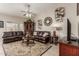 Relaxing living room with two leather sofas and a large flat-screen TV at 2878 N Paisley Ave, Casa Grande, AZ 85122