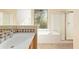 Bathroom with single vanity, shower, and bathtub, offering natural light at 2989 N 44Th St # 2001, Phoenix, AZ 85018