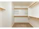 Spacious walk-in closet with ample shelving and hanging rods at 2989 N 44Th St # 2001, Phoenix, AZ 85018