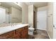 Bathroom with toilet, sink, and shower at 2989 N 44Th St # 2015, Phoenix, AZ 85018