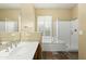 Bathroom with soaking tub, shower, and double vanity at 2989 N 44Th St # 2015, Phoenix, AZ 85018