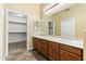 Double vanity bathroom with walk-in closet access at 2989 N 44Th St # 2015, Phoenix, AZ 85018