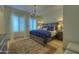 Spacious bedroom with plush bedding and chandelier at 2989 N 44Th St # 2015, Phoenix, AZ 85018