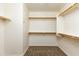 Large walk-in closet with ample shelving and hanging space at 2989 N 44Th St # 2015, Phoenix, AZ 85018