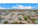 Aerial view of a luxury house with a pool, expansive views, and desert landscape at 34083 N Paseo Grande Dr, Queen Creek, AZ 85144