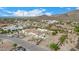 Aerial view of a luxury home with pool and meticulously landscaped desert lot at 34083 N Paseo Grande Dr, Queen Creek, AZ 85144