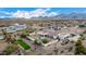 Aerial view of a luxury home with pool and desert landscaping, mountain backdrop at 34083 N Paseo Grande Dr, Queen Creek, AZ 85144