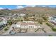 Aerial view of luxury home with pool and landscaped yard; mountain views at 34083 N Paseo Grande Dr, Queen Creek, AZ 85144