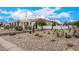 Landscaped front yard with desert plants and rock at 34083 N Paseo Grande Dr, Queen Creek, AZ 85144