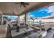 Covered patio with comfortable seating and a view of the pool at 34083 N Paseo Grande Dr, Queen Creek, AZ 85144