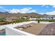 Relaxing rooftop deck with seating, mountain views, and partial pool view at 34083 N Paseo Grande Dr, Queen Creek, AZ 85144