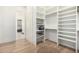 Large walk-in closet with ample shelving and storage at 34083 N Paseo Grande Dr, Queen Creek, AZ 85144