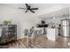 Modern white kitchen with island and glass dining table at 3511 E Baseline Rd # 1203, Phoenix, AZ 85042