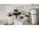 Modern white kitchen with stainless steel appliances at 3511 E Baseline Rd # 1203, Phoenix, AZ 85042