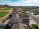 Overhead image of desert homes with private pools and golf course view at 3727 N Kings Peak N Cir, Mesa, AZ 85215