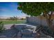 Backyard patio area under a tree with a view of the neighborhood at 3727 N Kings Peak N Cir, Mesa, AZ 85215