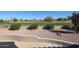 This backyard view shows the golf course, mature vegetation, and a low fence, providing privacy and a beautiful view at 3727 N Kings Peak N Cir, Mesa, AZ 85215