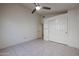 Cozy bedroom with tile flooring, ceiling fan, closet and doorway to another room at 3727 N Kings Peak N Cir, Mesa, AZ 85215