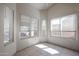 Light-filled bedroom featuring multiple windows with privacy blinds and neutral decor at 3727 N Kings Peak N Cir, Mesa, AZ 85215