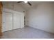 Bedroom featuring tile floor, ceiling fan, and closet at 3727 N Kings Peak N Cir, Mesa, AZ 85215