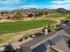 Picture of tile rooftops and desert homes with golf course in the background at 3727 N Kings Peak N Cir, Mesa, AZ 85215