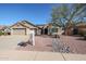 Charming single-Gathering home featuring a three-car garage and desert landscaping at 3727 N Kings Peak N Cir, Mesa, AZ 85215