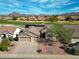 Attractive desert home showcases professionally landscaped front yard, 2-car garage, and solar panels at 3727 N Kings Peak N Cir, Mesa, AZ 85215