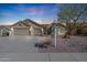 Beautiful single-Gathering home featuring a three-car garage and desert landscaping at sunset at 3727 N Kings Peak N Cir, Mesa, AZ 85215