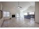 Open-concept living room featuring tile flooring, a fireplace, and a bright, airy atmosphere at 3727 N Kings Peak N Cir, Mesa, AZ 85215