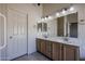 Well-lit bathroom with double sink vanity, large mirror, and ample storage at 3727 N Kings Peak N Cir, Mesa, AZ 85215