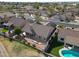 Aerial shot of desert home featuring tile roof, backyard patio, and green landscaping at 3727 N Kings Peak N Cir, Mesa, AZ 85215