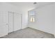 Bright bedroom with double door closet and neutral carpet at 37550 W San Clemente St, Maricopa, AZ 85138