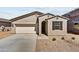 New single-story home with a two-car garage and neutral color palette at 37550 W San Clemente St, Maricopa, AZ 85138