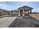 New single-story home with stone accents and a two-car garage at 37551 W Patterson St, Maricopa, AZ 85138