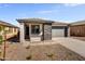 New construction home with gray exterior, stone accents, and a two-car garage at 37566 W San Clemente St, Maricopa, AZ 85138