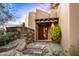 Exterior view of stucco home with stone accents at 39863 N 105Th Pl, Scottsdale, AZ 85262