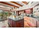 Gourmet kitchen boasts a large island, custom cabinetry, and high-end appliances at 39863 N 105Th Pl, Scottsdale, AZ 85262