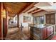 Kitchen features stone island, wood cabinets, and hardwood floors at 39863 N 105Th Pl, Scottsdale, AZ 85262