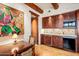 Cozy kitchenette with dark wood cabinets and modern appliances at 39863 N 105Th Pl, Scottsdale, AZ 85262