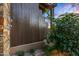 Private outdoor shower with stone and wood accents at 39863 N 105Th Pl, Scottsdale, AZ 85262