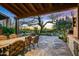 Stone patio with seating and scenic sunset views at 39863 N 105Th Pl, Scottsdale, AZ 85262