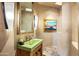 Chic powder room with green concrete sink and rustic wood vanity at 39863 N 105Th Pl, Scottsdale, AZ 85262